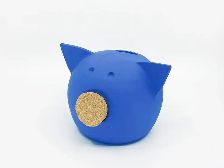 1. Brîndușă de cauciuc albastră în formă de purceluș pentru copii.