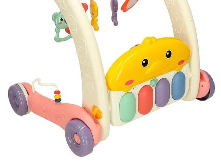 Cute pink and yellow baby walker with interactive toys and musical features for toddlers.