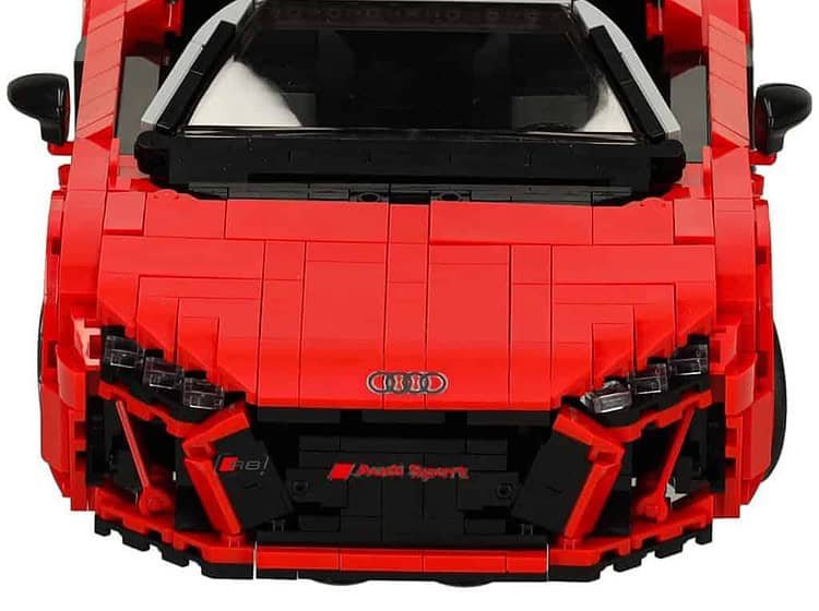 Joaca cu legos portocaliu pentru copii din plastic, ideală pentru construcție și dezvoltarea creativității.