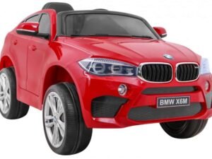 Red toy BMW X6M electric ride-on car for children.