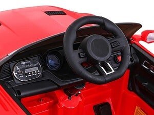 1. Jucarie in forma de masina sport pentru copii, rosu și negru, cu volan și dashboard detaliat.
