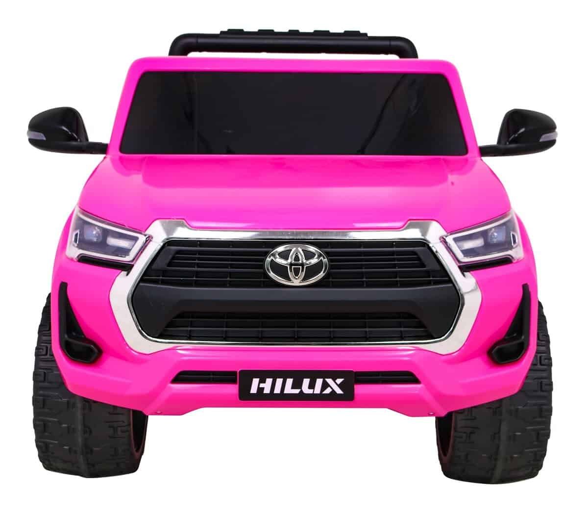 1. Mașinuță electrică pentru copii, model Toyota Hilux, culoare roz.