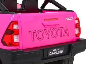 Pink toy truck with "TOYOTA" inscription, perfect for kids' play areas.