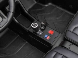 1. Toggle switch and key ignition inside vehicle, black interior accessories.
