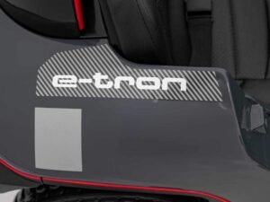 E-tron logo auto electric compact car, modern vehicle design.