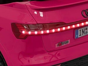 Pink car tail light with LED technology, stylish and modern design.