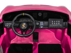 Pink children's ride-on car interior, dashboard, steering wheel, and digital panel.