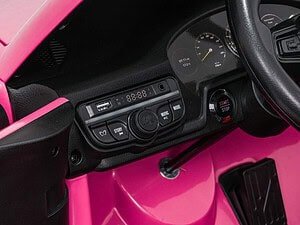 Cute pink children's playhouse with realistic car dashboard and start/stop button, perfect for imaginative play.