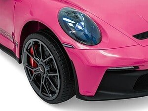 Mașină sport roz cu aspect elegant și design modern, perfect pentru pasionații de automobile.