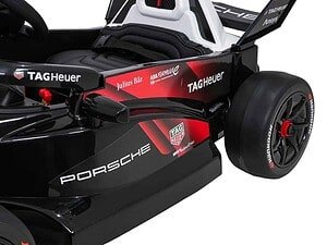 Mașinuță de curse electrică pentru copii, design realist și siguranță în joacă.