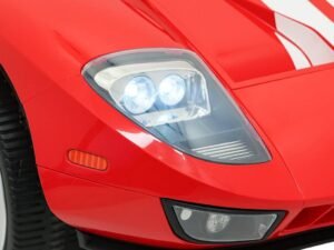 Mașină sport roșie cu faruri LED și design modern.