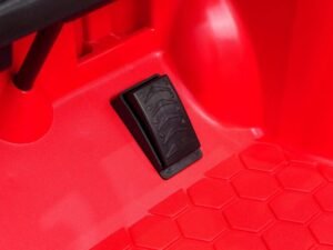 Accesoriu pentru jucării, pedală pentru mașinuță de plastic roșie.